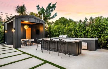 modern-outdoor-kitchen-and-dining-area-at-sunset-2026-03-18-09-36-15-utc (1)