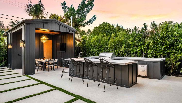 modern-outdoor-kitchen-and-dining-area-at-sunset-2026-03-18-09-36-15-utc (1)