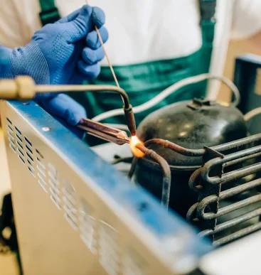 worker-with-burner-repairs-cooling-system-2026-01-06-09-22-07-utc (1)-optimized